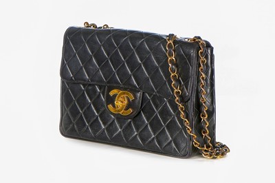 Lot 11 - A Chanel quilted leather jumbo flap bag, late...