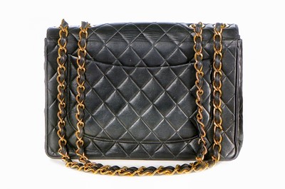 Lot 11 - A Chanel quilted leather jumbo flap bag, late...