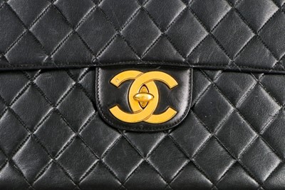 Lot 11 - A Chanel quilted leather jumbo flap bag, late...