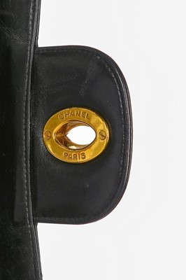 Lot 11 - A Chanel quilted leather jumbo flap bag, late...