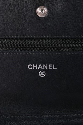 Lot 24 - A Chanel WOC of camellia-embossed black...