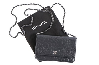 Lot 24 - A Chanel WOC of camellia-embossed black...