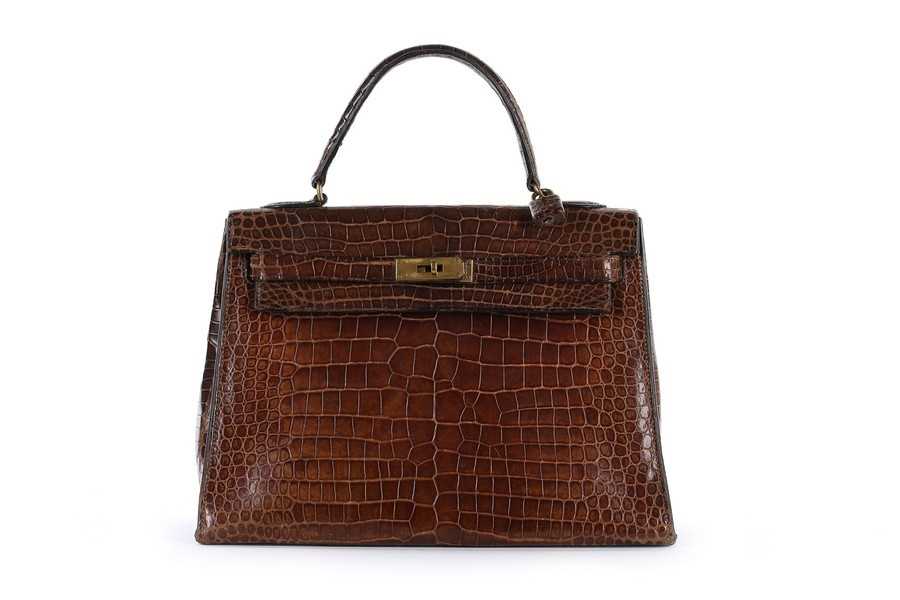 Lot 7 - An Hermès brown crocodile Kelly bag, 1962,...