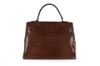 Lot 7 - An Hermès brown crocodile Kelly bag, 1962,...