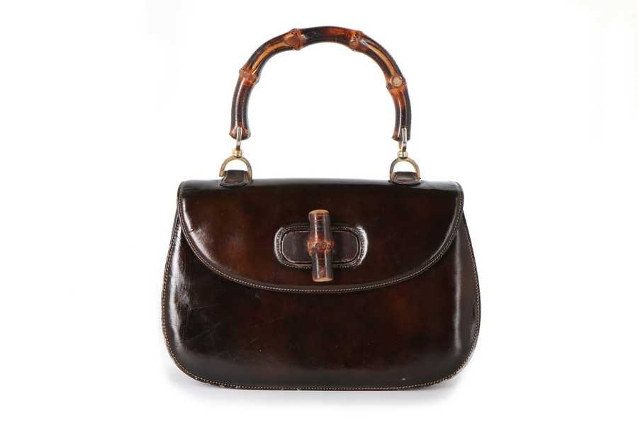 Lot 8 - A Gucci handbag with bamboo handle, 1960s,...
