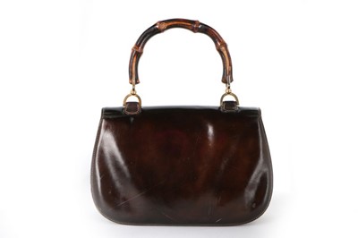 Lot 8 - A Gucci handbag with bamboo handle, 1960s,...