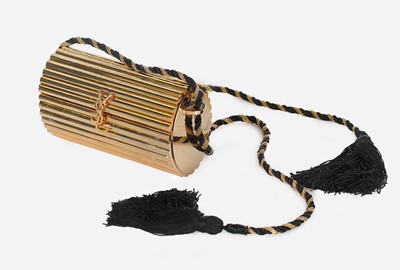 Lot 2 - An Yves Saint Laurent gilt resin cylindrical...