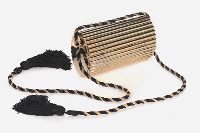 Lot 2 - An Yves Saint Laurent gilt resin cylindrical...