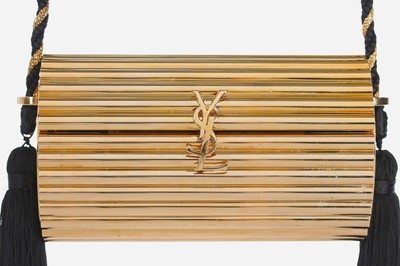 Lot 2 - An Yves Saint Laurent gilt resin cylindrical...