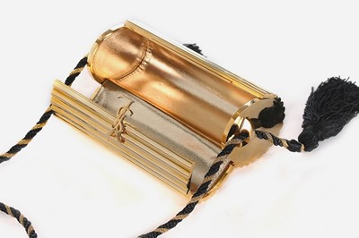 Lot 2 - An Yves Saint Laurent gilt resin cylindrical...