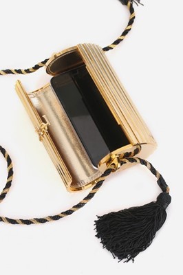 Lot 2 - An Yves Saint Laurent gilt resin cylindrical...