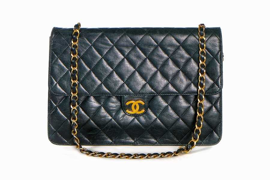 Lot 1 - A Chanel navy quilted lambskin leather flap...