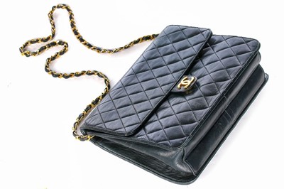 Lot 1 - A Chanel navy quilted lambskin leather flap...