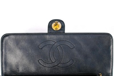 Lot 1 - A Chanel navy quilted lambskin leather flap...