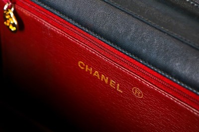 Lot 1 - A Chanel navy quilted lambskin leather flap...