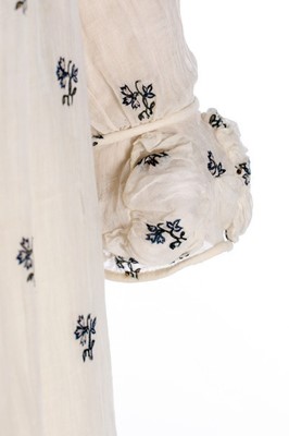 Lot 35 - A sprigged muslin dress, circa 1815,...