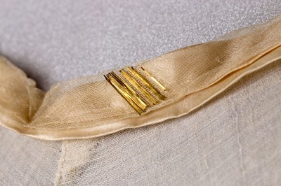 Lot 37 - A brocaded muslin evening dress, circa 1820,...