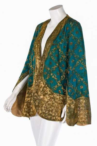 Lot 64 - A stencilled green velvet jacket, probably...