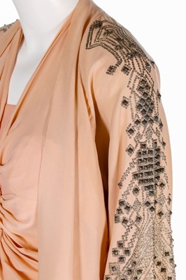 Lot 70 - A pink crêpe romaine evening ensemble,...