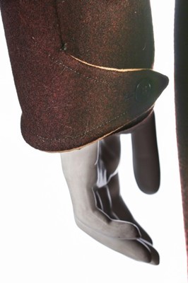 Lot 73 - A brown wool ski suit, 1930s, the jacket with...