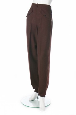 Lot 73 - A brown wool ski suit, 1930s, the jacket with...