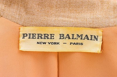 Lot 82 - A Pierre Balmain couture oatmeal linen suit,...