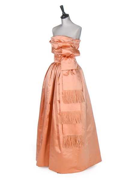 Lot 89 - A Christian Dior London salmon-pink satin ball...