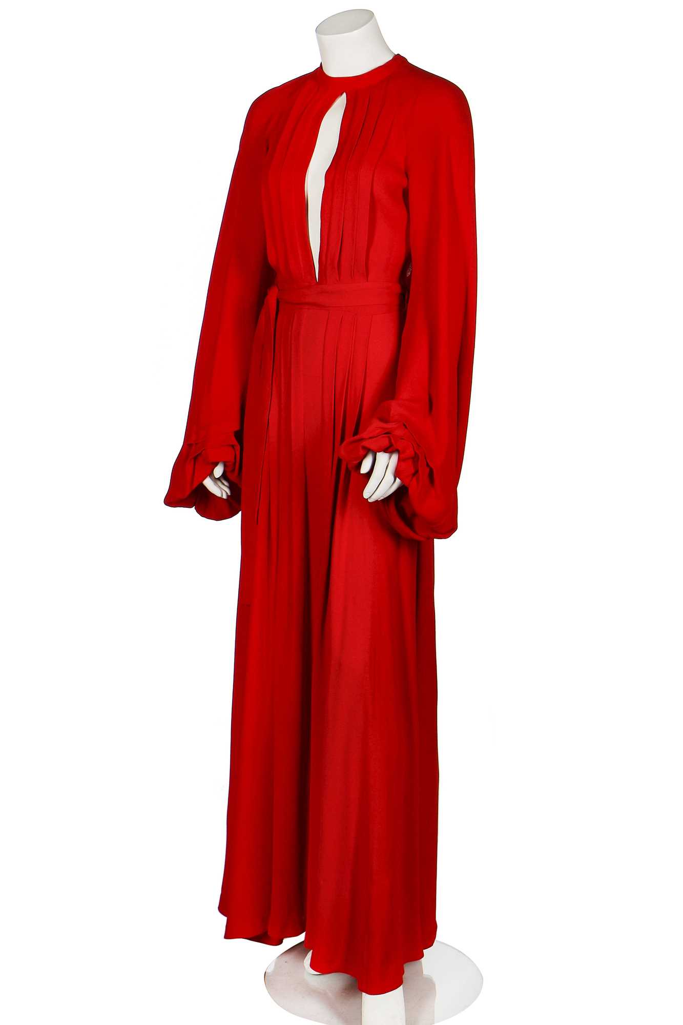 Lot 164 - An Ossie Clark red moss crêpe 'Cuddly' wrap-over dress, mid 1970s