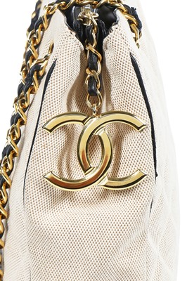 Lot 1 - A Chanel quilted canvas and navy lambskin leather bag, Spring-Summer 1991 ready-to-wear