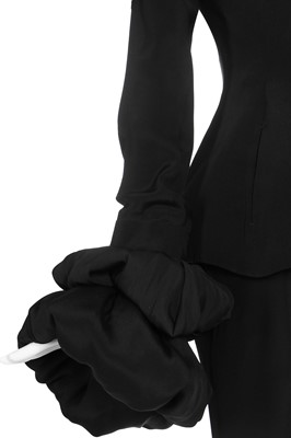 Lot 189 - A Yohji Yamamoto black silk suit with padded cuffs, 1990s