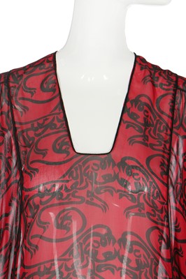 Lot 135 - A Thea Porter chiffon abaya printed with calligraphic beasts, 1970s