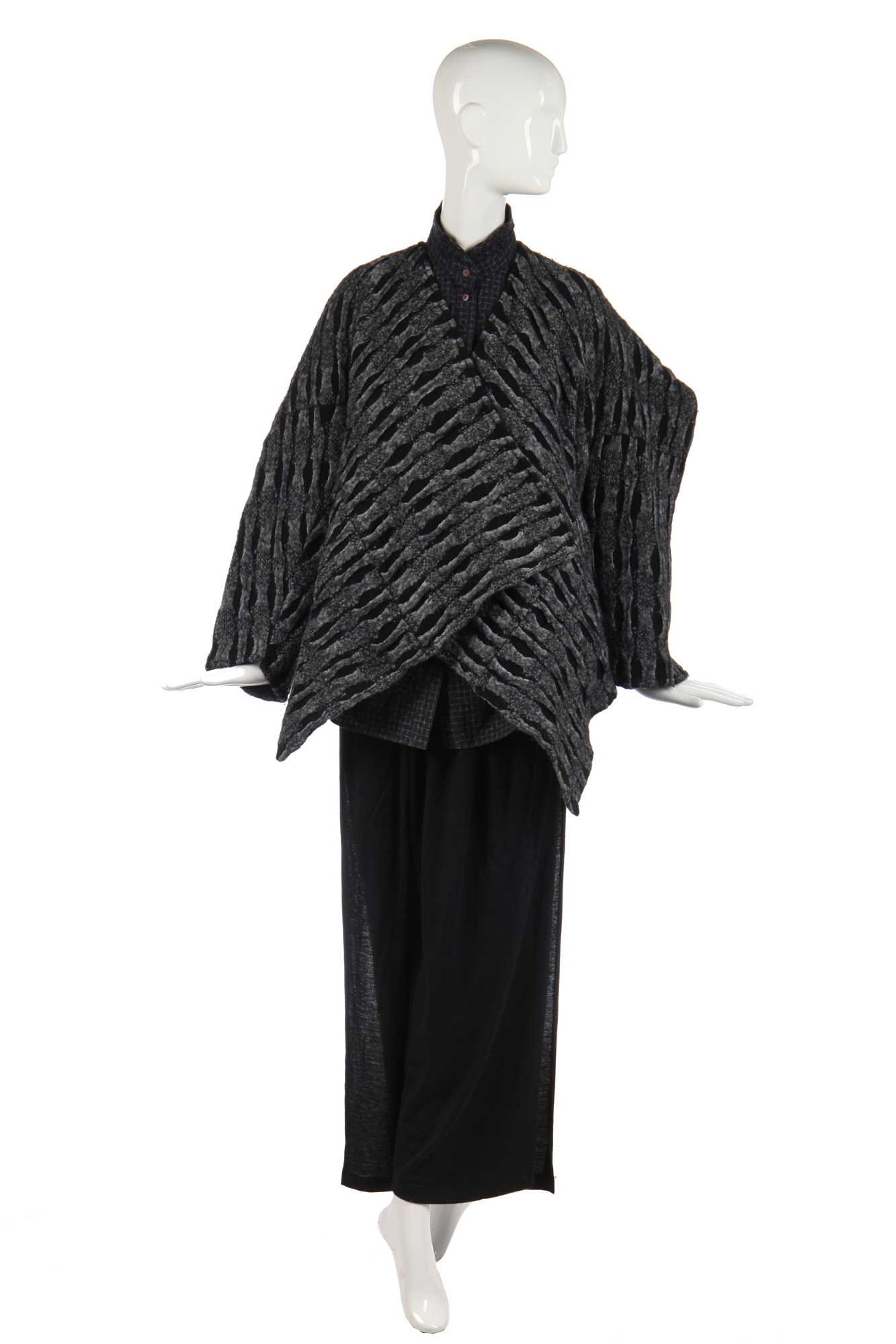 Lot 344 - An Issey Miyake textured wool jacket in shades of blue-grey and black, circa 1983