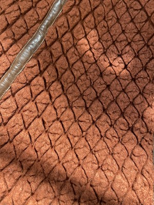 Lot 188 - An Issey Miyake two-piece ensemble in shades of brick-orange and black, circa 1977