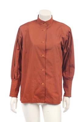 Lot 188 - An Issey Miyake two-piece ensemble in shades of brick-orange and black, circa 1977