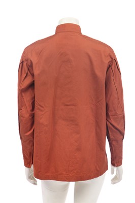Lot 188 - An Issey Miyake two-piece ensemble in shades of brick-orange and black, circa 1977