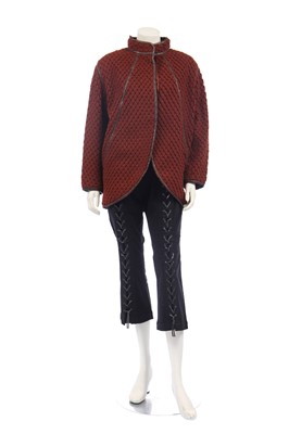 Lot 188 - An Issey Miyake two-piece ensemble in shades of brick-orange and black, circa 1977