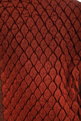 Lot 188 - An Issey Miyake two-piece ensemble in shades of brick-orange and black, circa 1977