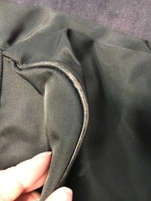 Lot 184 - An Issey Miyake black nylon convertible duffle bag/backpack, probably 1990s