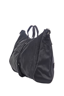 Lot 184 - An Issey Miyake black nylon convertible duffle bag/backpack, probably 1990s