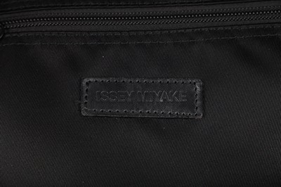 Lot 184 - An Issey Miyake black nylon convertible duffle bag/backpack, probably 1990s