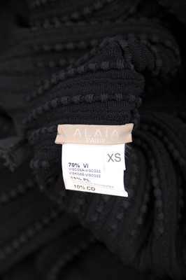 Lot 169 - An Azzedine Alaïa ribbed black viscose dress, modern