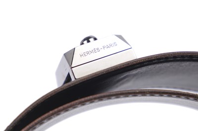 Lot 56 - An Hermès black leather belt with metal 'lock' clasp, modern