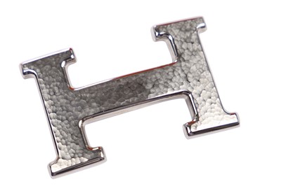 Lot 56 - An Hermès black leather belt with metal 'lock' clasp, modern