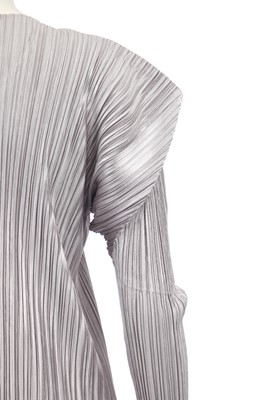Lot 183 - An Issey Miyake pleated silver polyester full-length coat, probably 1990s