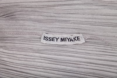 Lot 183 - An Issey Miyake pleated silver polyester full-length coat, probably 1990s