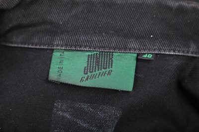 Lot 191 - A pair of Jean Paul Gaultier jeans printed with 'fight racism' and peace symbols, 2000s