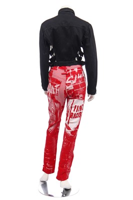 Lot 191 - A pair of Jean Paul Gaultier jeans printed with 'fight racism' and peace symbols, 2000s