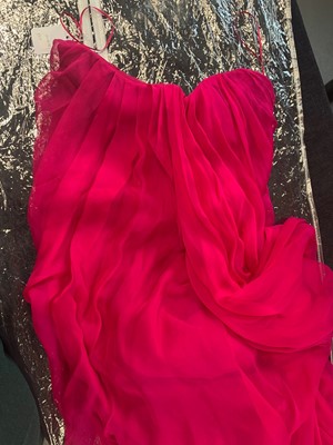 Lot 113 - An Alexander McQueen raspberry-pink silk chiffon evening gown, circa 2008
