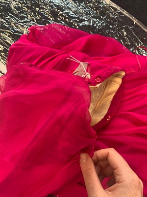 Lot 113 - An Alexander McQueen raspberry-pink silk chiffon evening gown, circa 2008