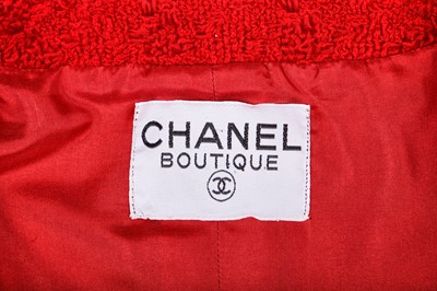 Lot 11 - A Chanel cherry-red tweed suit, late 1980s-early 1990s